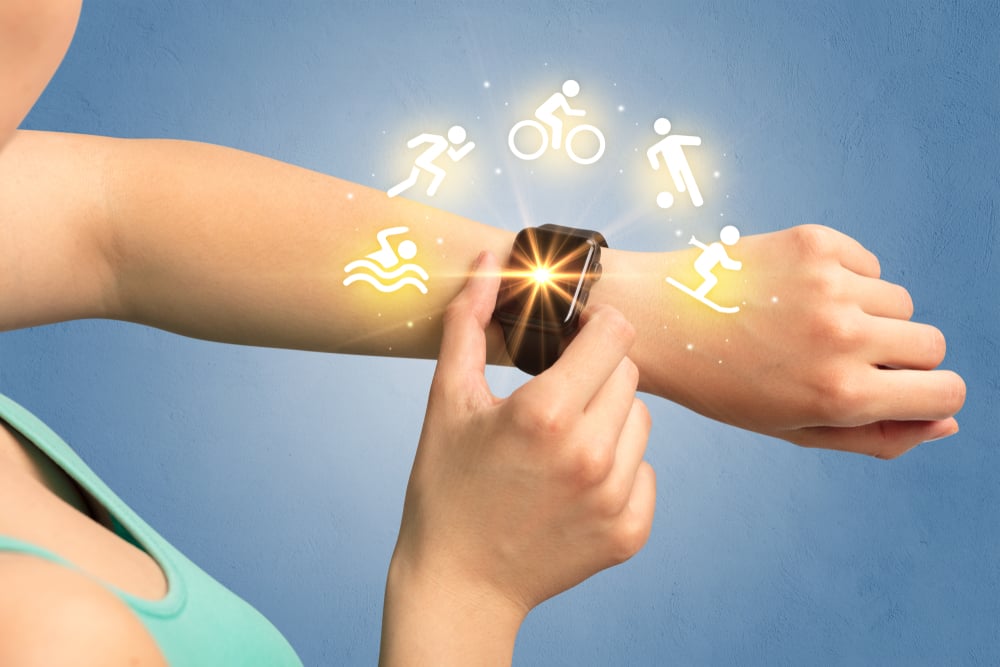 Female hand with smartwatch and sport concept.