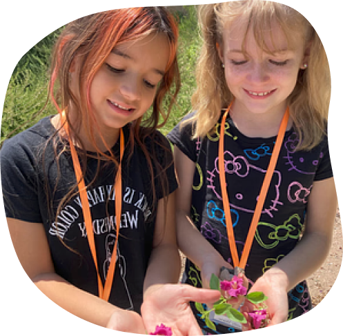 Girls in Classical Communities showing flowers